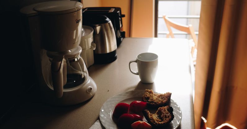 Coffee Maker - White Ceramic Mug Beside Ceramic Plate On Table