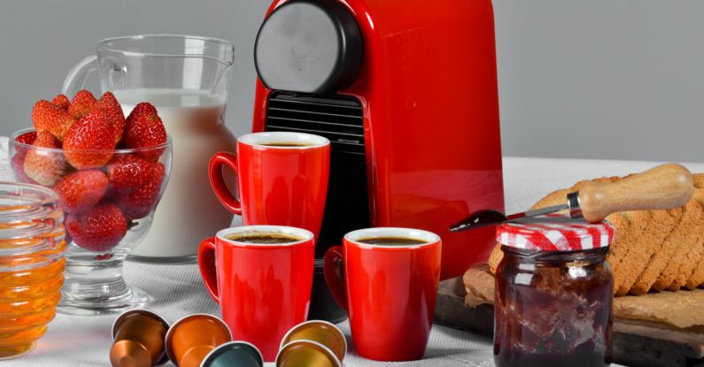 Coffee Maker - Red Ceramic Mug Filled With Coffee Near Jam Jar on Table