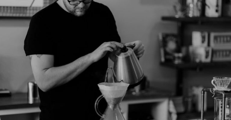 Coffee Maker - Man Pouring Liquid on Teapot