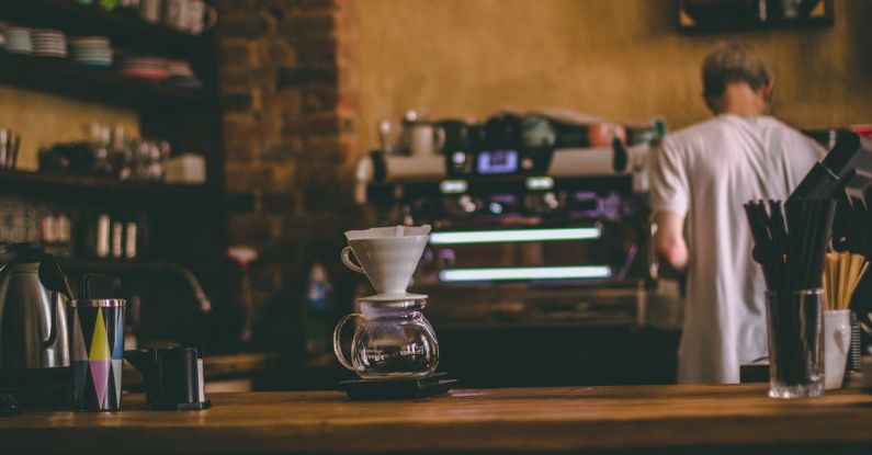 Coffee Maker - Man Standing Beside Commercial Espresso Machine