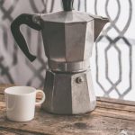 Coffee Maker - Gray Moka Pot Beside White Ceramic Cup on Brown Wooden Table