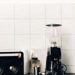 Coffee Maker - A Coffee Maker Beside Black Speaker on Kitchen Table Top