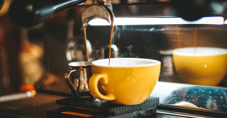 Coffee Maker - Espresso Machine Dispensing on Two Mugs